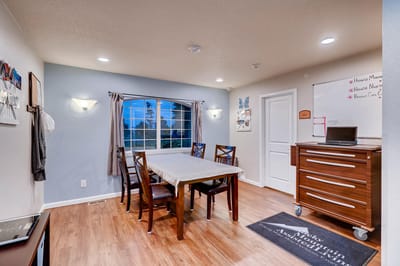A warm, inviting common area with a dining table