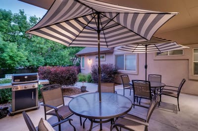Outdoor dining area with umbrellas and seating