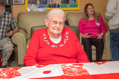 Elderly resident participating in an activity in a common area