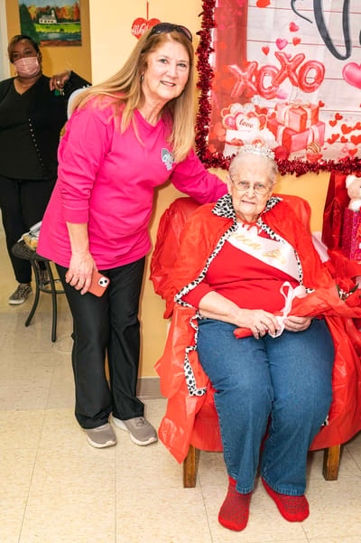 Caregiver with resident celebrating Valentine's Day