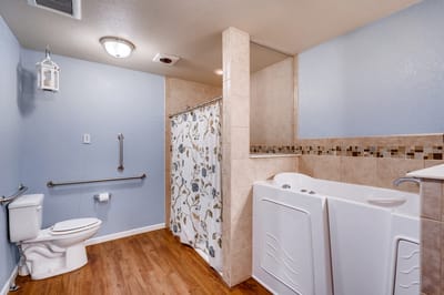 A well-lit accessible bathroom with safety features