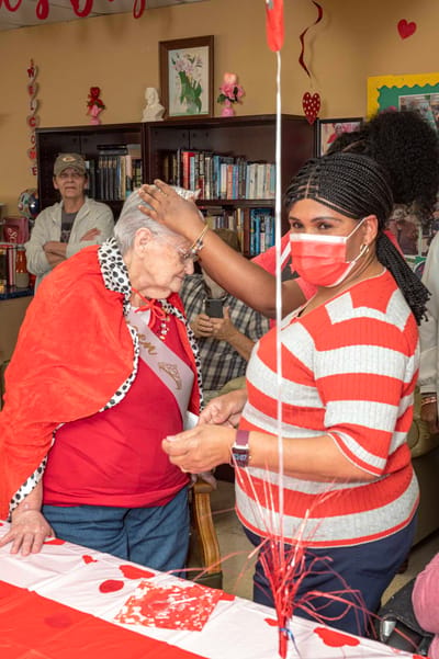 A resident receiving care during a celebration event