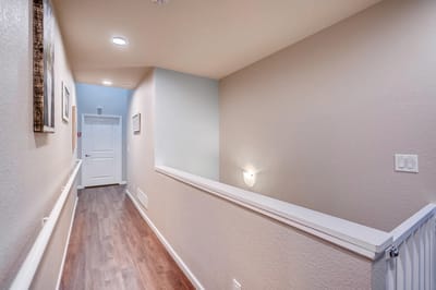 Bright interior hallway with wooden flooring