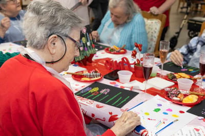 Residents participating in a creative arts activity