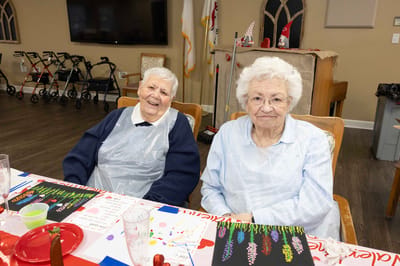 Two residents enjoying an activity in a common area