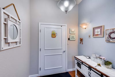 Welcoming entrance hallway with decor and a mirror