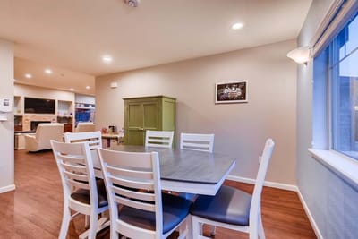 Interior view of a common area with dining table and chairs