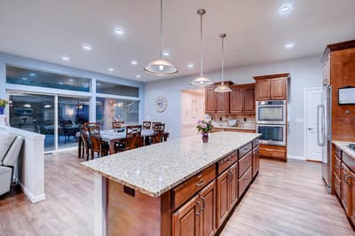 Bright kitchen area with dining table and flowers