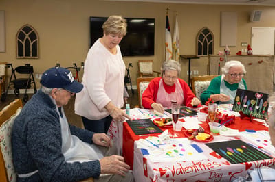 Residents participating in a Valentine's Day art activity