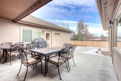 Outdoor patio seating area with tables and chairs