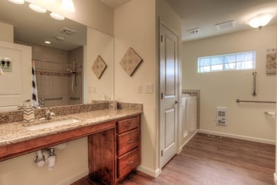 Bright bathroom in a resident room, featuring modern fixtures