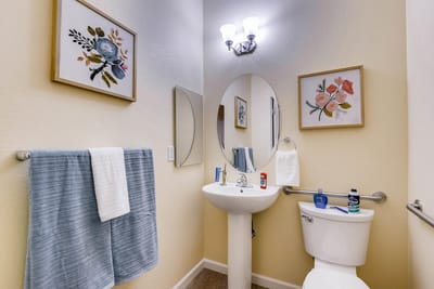 Well-decorated bathroom with floral art