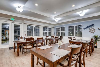Bright dining area with wooden tables and chairs