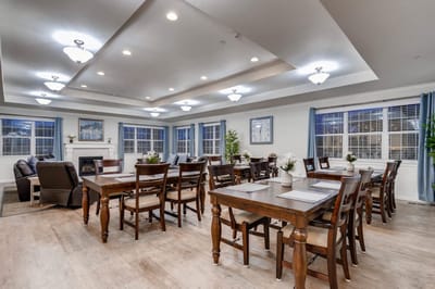 Bright dining area with wooden tables and chairs