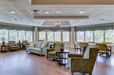Bright common area with comfortable seating and large windows