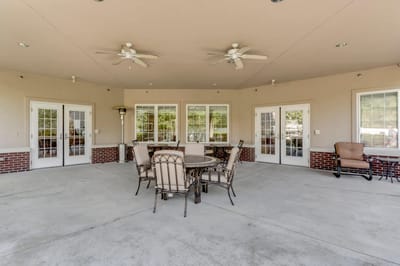 Outdoor seating area with tables and chairs