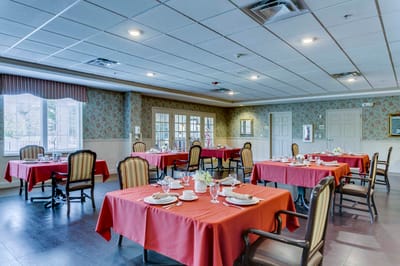 Dining area set for a meal in a vibrant interior.