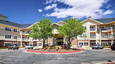 Exterior view of MacKenzie Place with green trees