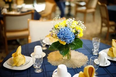 Vibrant dining table setup with flowers and dishes