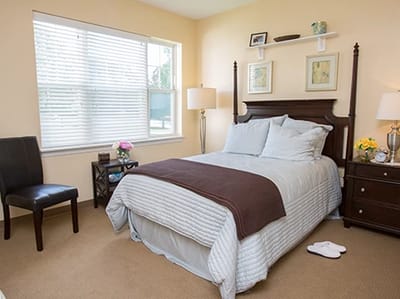 Cozy private bedroom with a bed and window