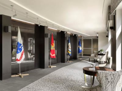 Interior corridor with flags and seating area