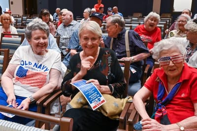 Residents enjoying a lively activity in an event room