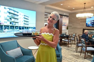 Resident serving drinks in a common area