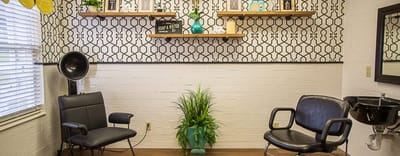 Hair salon chairs in a bright interior space
