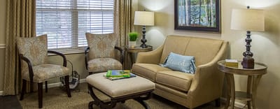 Cozy interior seating area with comfortable chairs and a sofa