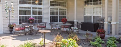 Outdoor patio area with seating and flowers
