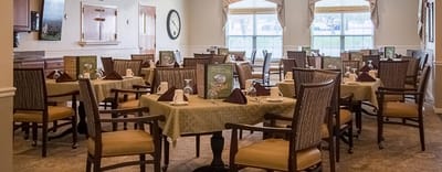 Brightly lit dining area with tables set for meals