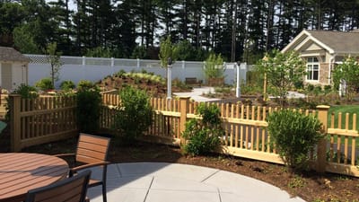 Garden area with a wooden fence and seating