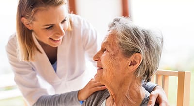 Caregiver interacting with a senior resident