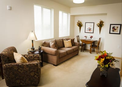 Cozy living area in a resident's room with floral decor