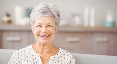 Smiling senior woman in a bright room