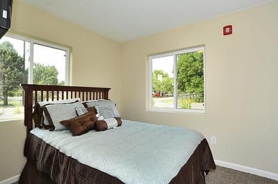 Cozy private room with bed and windows
