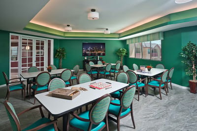 Bright common area with tables and chairs
