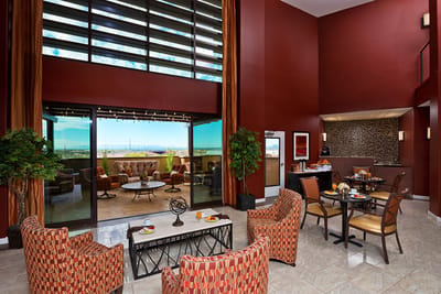 Bright common area with seating and outdoor view