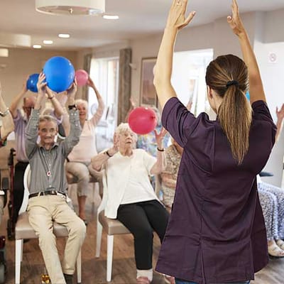 Residents participating in a balloon exercise activity