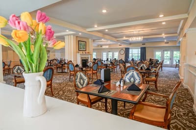 Interior view of a dining room with tables and chairs