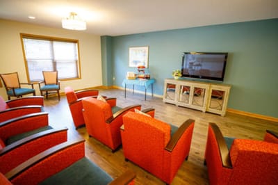 Comfortable common area with seating and a TV