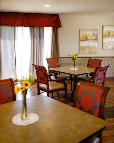 Dining area with tables and floral decorations