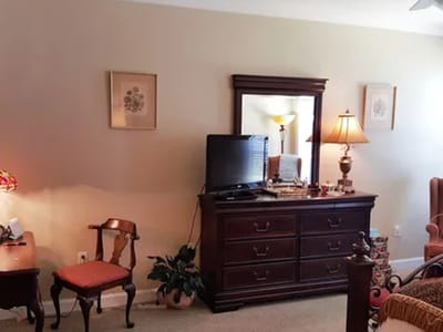A well-furnished room in a senior living facility