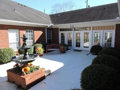 Outdoor courtyard with fountain and seating area