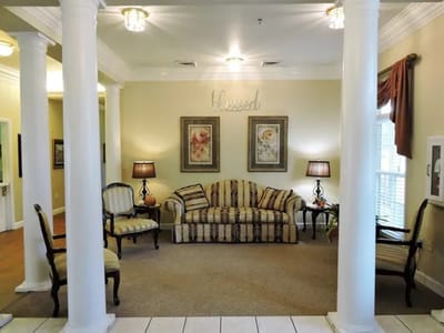 Living room area with seating and decorative elements