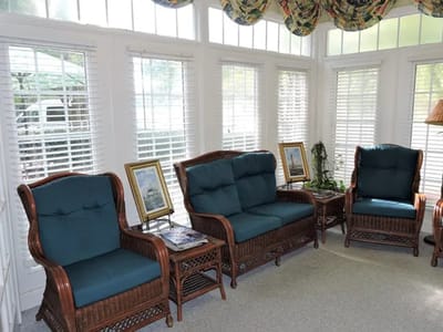 Cozy lounge area with rattan furniture and natural light