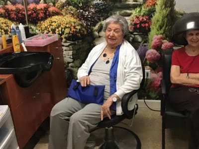 Residents enjoying a salon service in a cozy interior