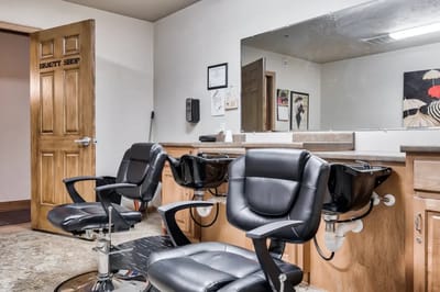 Interior view of a beauty shop with salon chairs