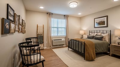 Cozy private resident room with artwork and bedding