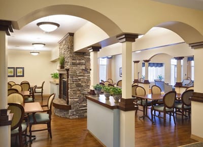 Bright common area with dining tables and chairs